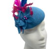 Blue felt headpiece with blue felt flowers, finished with pink and blue arrow feathers.